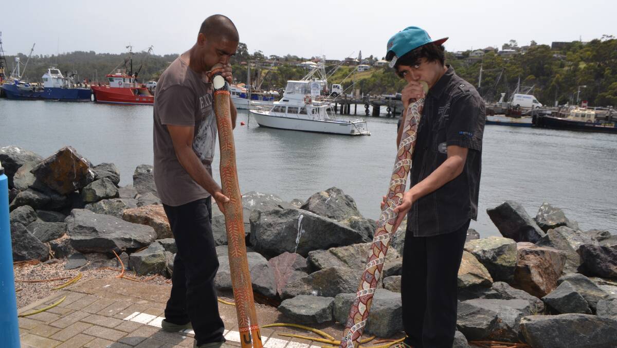 INDIGENOUS WELCOME: Boden Douglas and Darren Mongta welcomed the cruise passengers with digiredoo playing on the Eden wharf. 
 