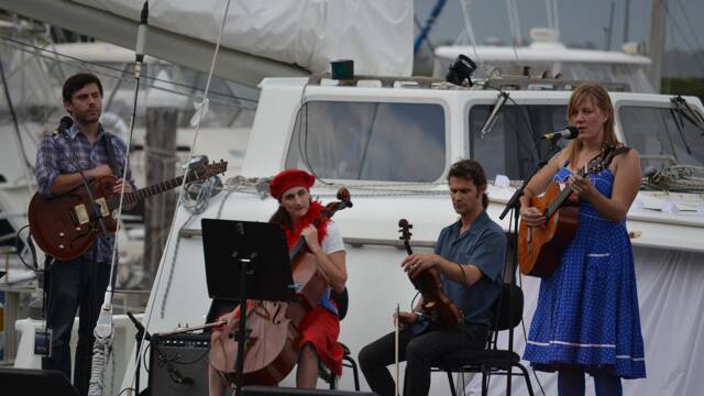 HARBOUR PERFORMANCE: Melanie Horsnell of Candelo and her band perform on the MV Pelican at the free Four Winds community concert at the Bermagui Fisherman's Wharf.