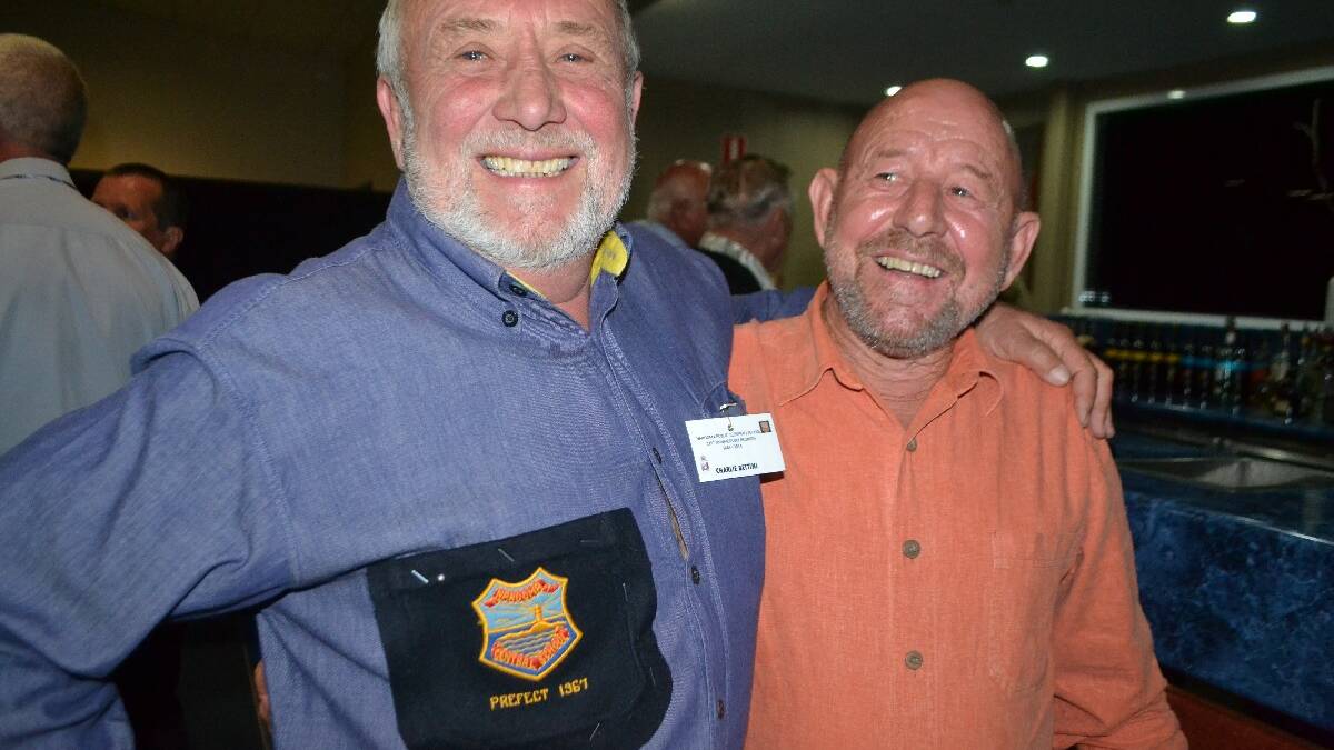 OLD MATES: Charlie Bettini proudly wore his 1967 prefect badge at the
Narooma Public School 125th anniversary cocktail evening and is
pictured with school mate Paul Philip.
 