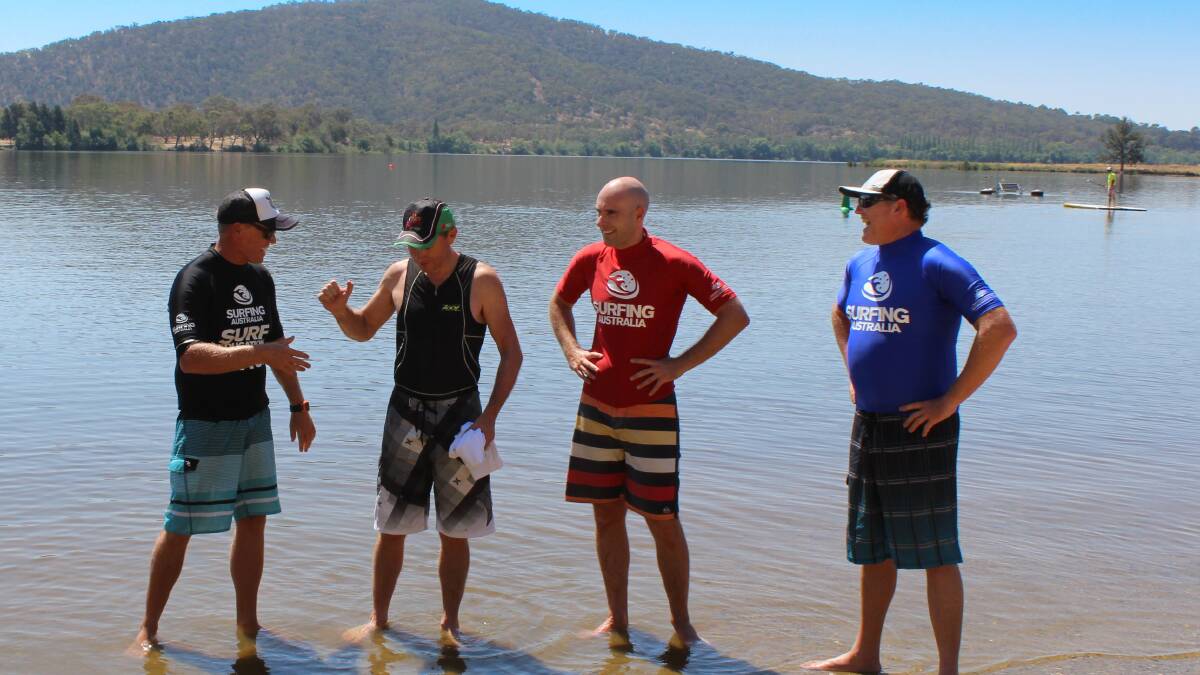 THANKS MACCA: Member of Bowman Andrew Laming thanking SUP coach Andrew “Macca” McCaughtrie with Surfing Australia general manager Chris Symington and chief executive Andrew Stark. 