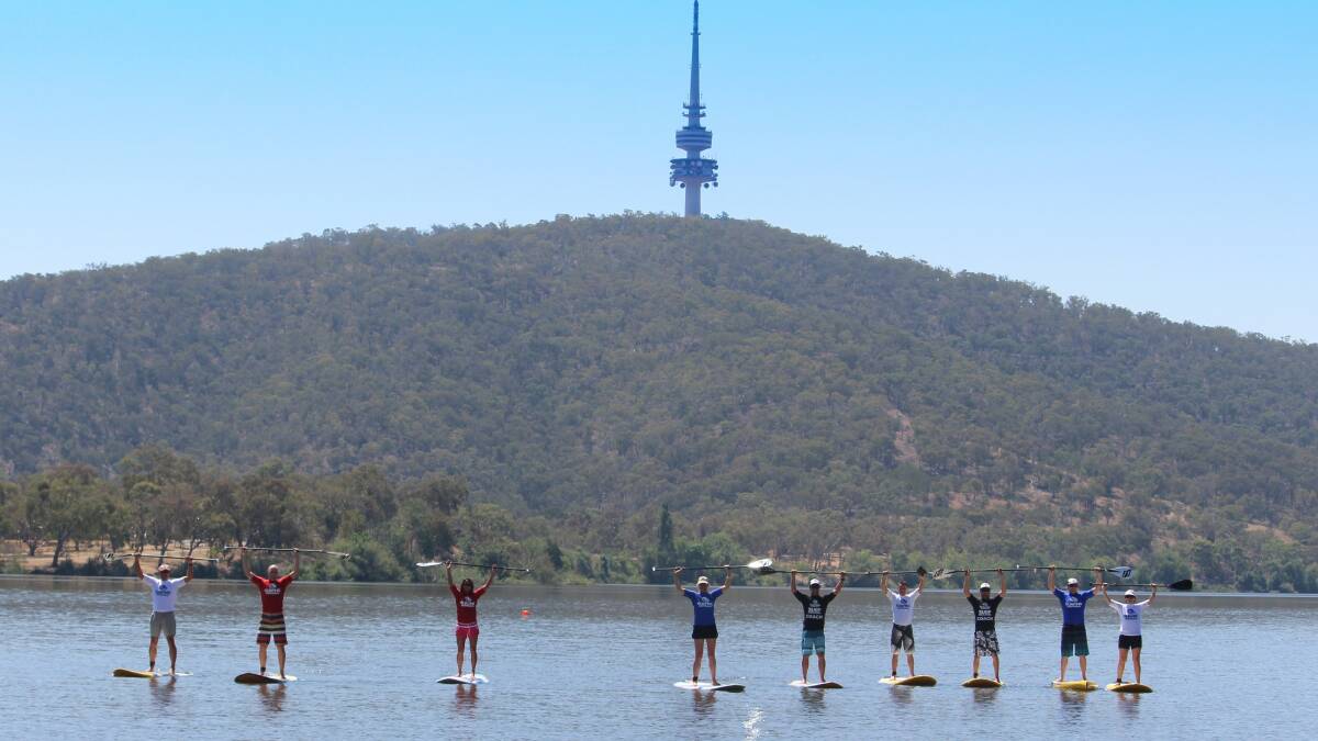  PADDLES UP: Time for a good old SUP “Paddles up!” on Lake Burley Griffin.