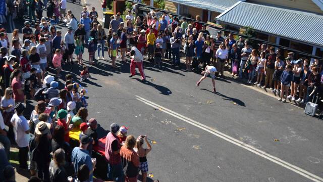 EGG ACTION: The egg toss is always a big hit at the Tilba Festival, as seen from the upper deck of The Drom Hotel.