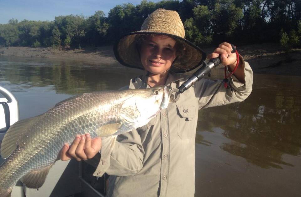 FIRST BARRA: Digger Cowie from Narooma got his first barramundi with his dad up in the Northern Territory. 