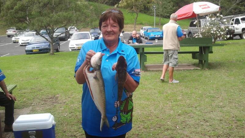 MOYA’S HAUL: Narooma Bolwo fishing club member Moya Hicks weighs in her mixed bag of a salmon and flathead. 