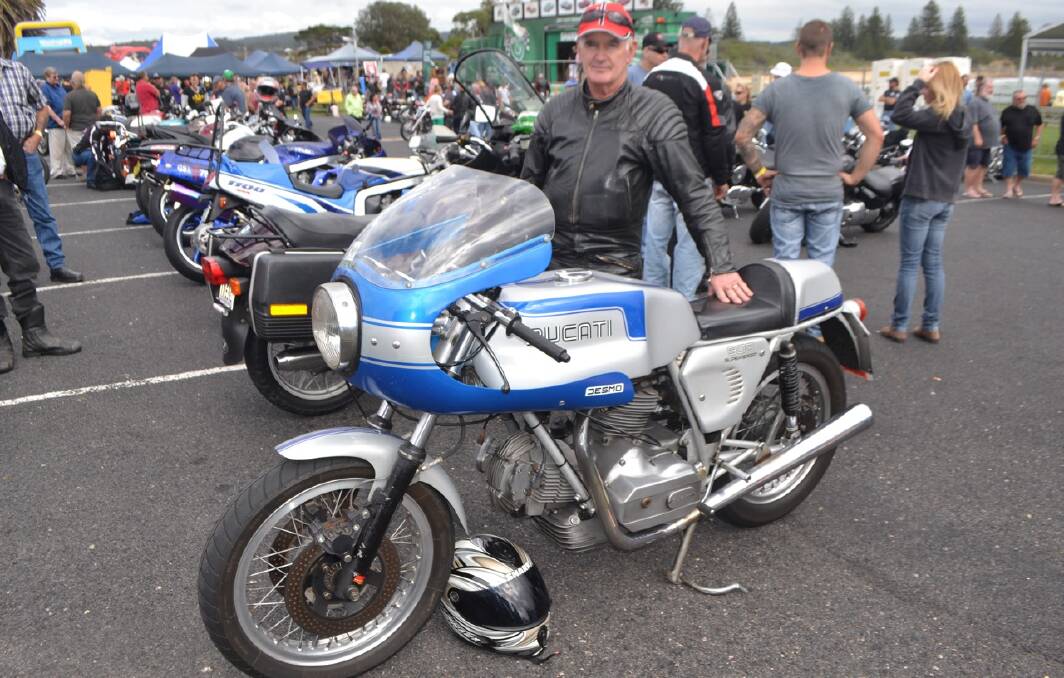 RARE DUCATI: Allen Hawkins of Long Beach with his rare 1975 Ducati
900SS, only 250 were made, of which 98 imported to Australia. Made
strictly for production road racing it "rides like it's on rails".