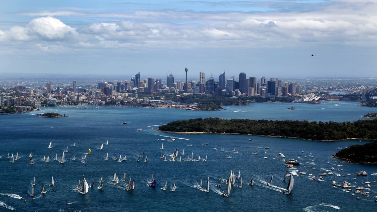 The start of the Rolex Sydney to Hobart yacht race 2012 as 77
competing yachts sail out of Sydney Harbour through the heads along
the NSW coast towards Tasmania's Constitution Dock.