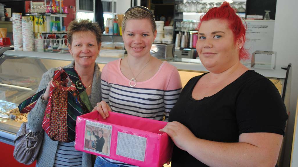 TIE BAGS: Karen Baker, Michele Bruest and Sarah Walters with the tie donation box at the Narooma Icecreamery.