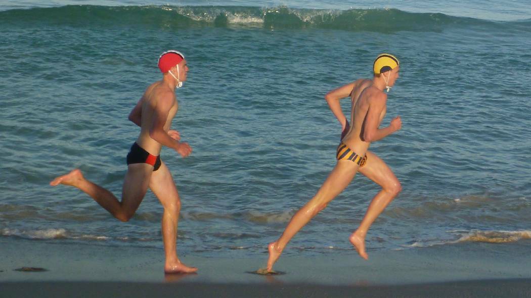HIGH RANKING: Narooma’s Joe Halsey competed in the U17s Beach Sprints and long distance running coming sixth and fourth respectively. He is pictured running against a North Cronulla competitor.