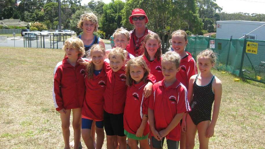 NAROOMA SWIM TEAM: Narooma swimmers from front left Banjo King, Ruby O'Meara, Michala Pendergast, Ivy O'Meara and Josh Ryan. Back from left Riley Miles, Aiden, coach Rhett Dufty, Sophie O'Meara, Georgia Pendergast and Milaina Café.