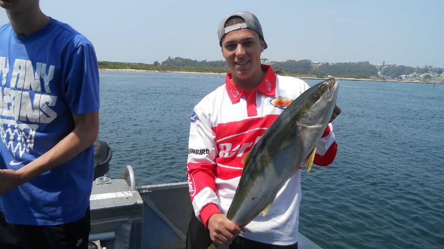 FIRST KINGIE: Adam Binns of Melbourne with his first kingfish taken aboard Narooma Fishing Charter's "Aquanaut".
