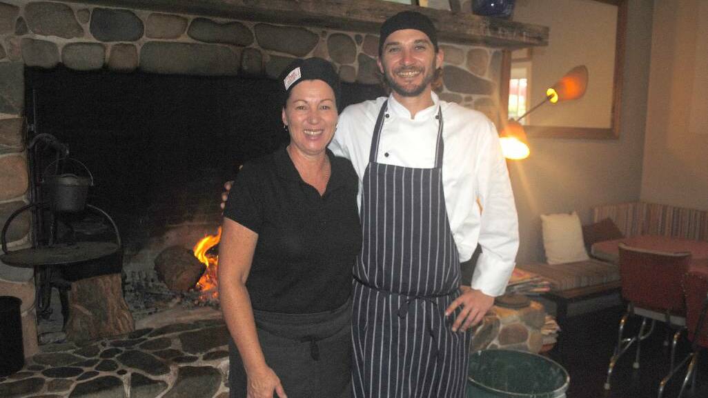 DAIRY SHED CREW: Adele Byers with chef Leigh Pike in front of the big warm open fire at the Bodalla Dairy Shed.