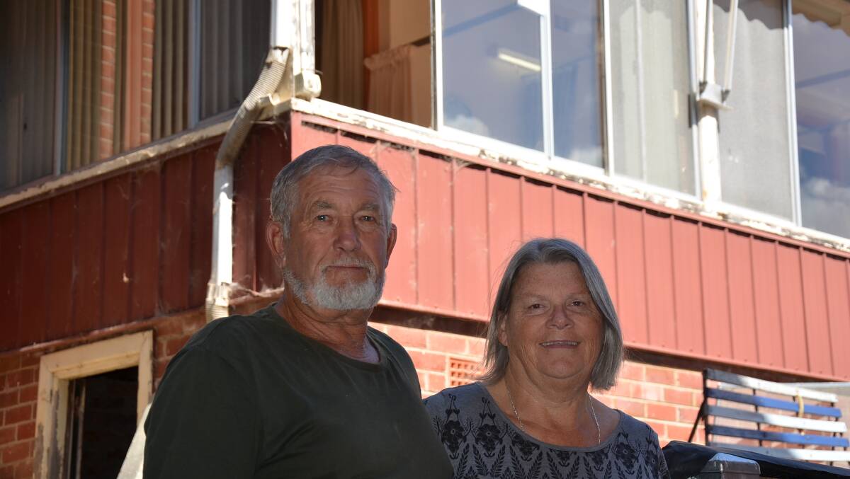 SWEET VICTORY: Ron and Tralee Snape are not sorry the community can say goodbye to the old Moruya oncology ward, pictured behind, but are delighted cancer patients have moved into a bright new facility.