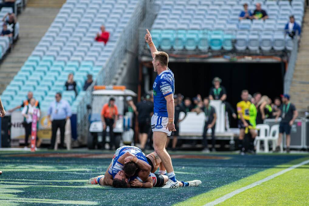 STUNNER: Teig Wilton celebrates after the Newtown Jets scored a try in the final seconds of Sunday's NRL State Championship grand final. Photo: Mario Facchini/mafphotography.