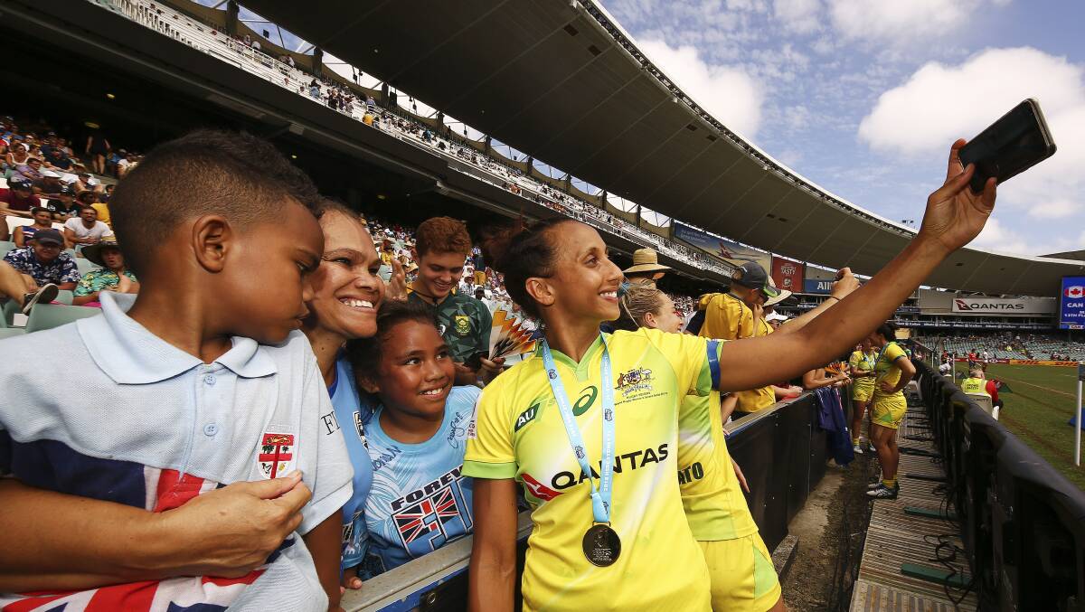 Cassie Staples poses with Fijian fans after a recent HSBC World Sevens Series tournament. Photo: RA Media/Karen Watson.