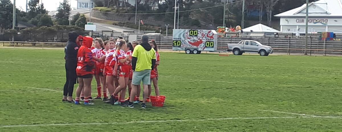 A class above: The under 13 girls league tag side had a huge 82-0 win over Eden last weekend. That's the half-time score in the background!