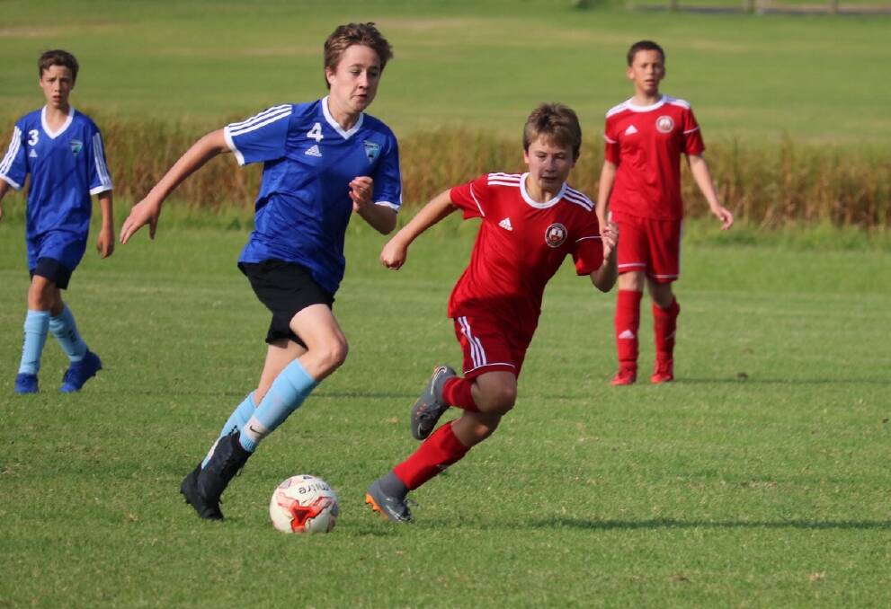 Fierce contest: Narooma FC U13s and Moruya Royals served up a feast of football, much to the delight of both sets of supporters. Narooma ended up taking the game 4-2.