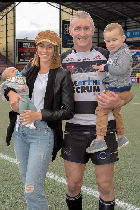 Chris Houston with his wife Amy and his two sons Kai and Harvey after a game in England. Photo: Provided.