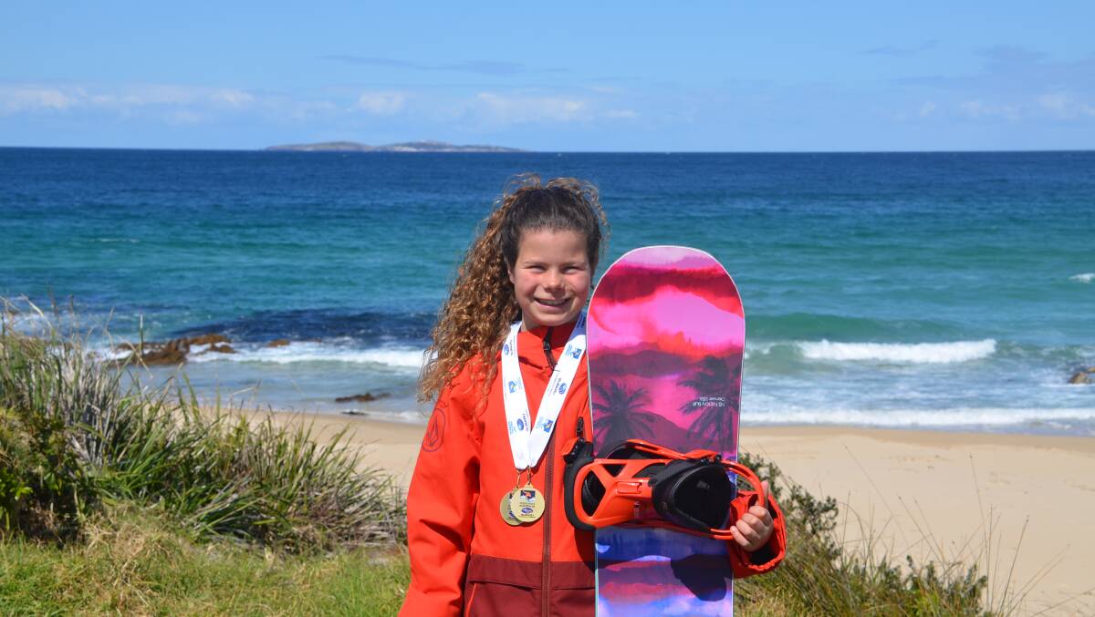 ALL SMILES: Ali Guseli poses near her home in Dalmeny with her two gold medals won at the Australian Interschools Snowsports Championships.