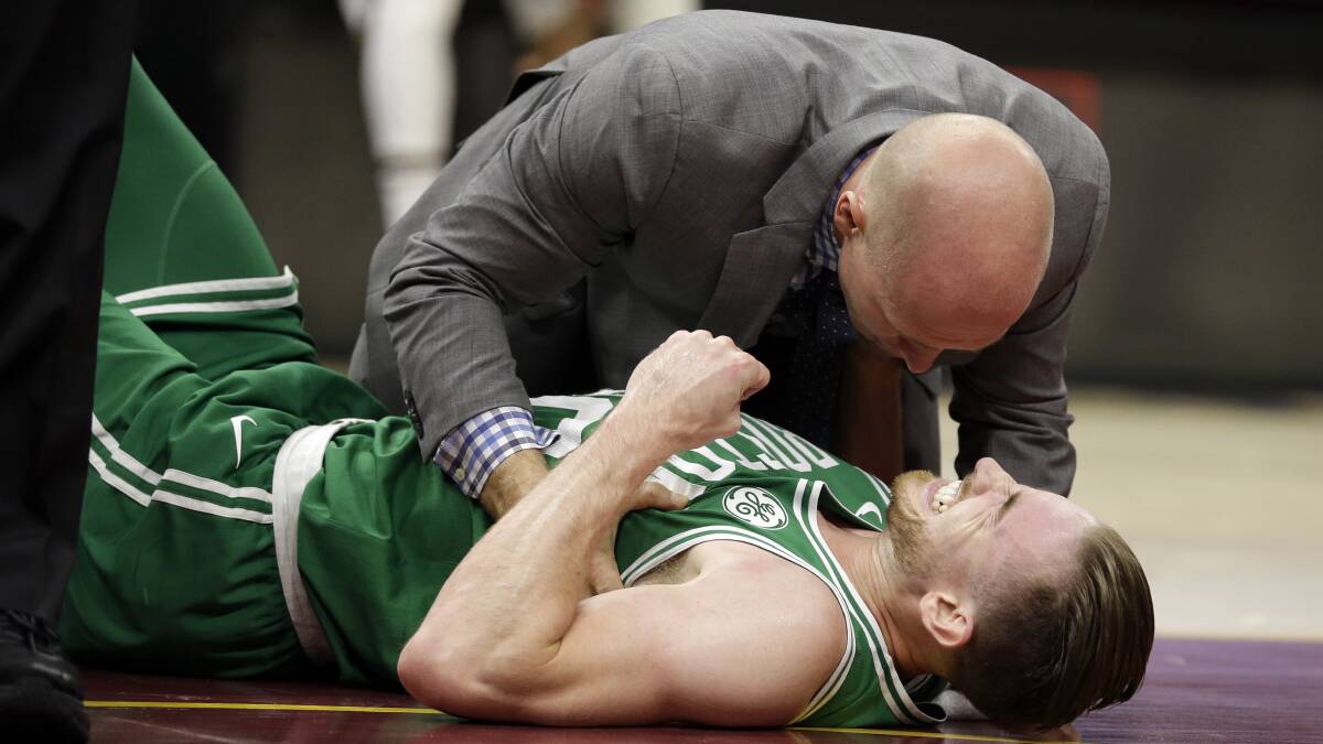 Gordon Hayward grimaces in pain after his gruesome ankle injury. Photo: AP Photo/Tony Dejak