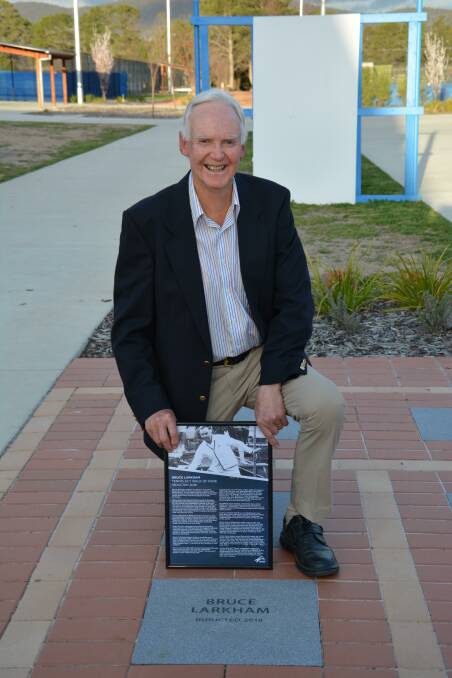 LEGEND: Bruce Larkham with his new plaque on the Tennis ACT Walk of Fame. Photo supplied.