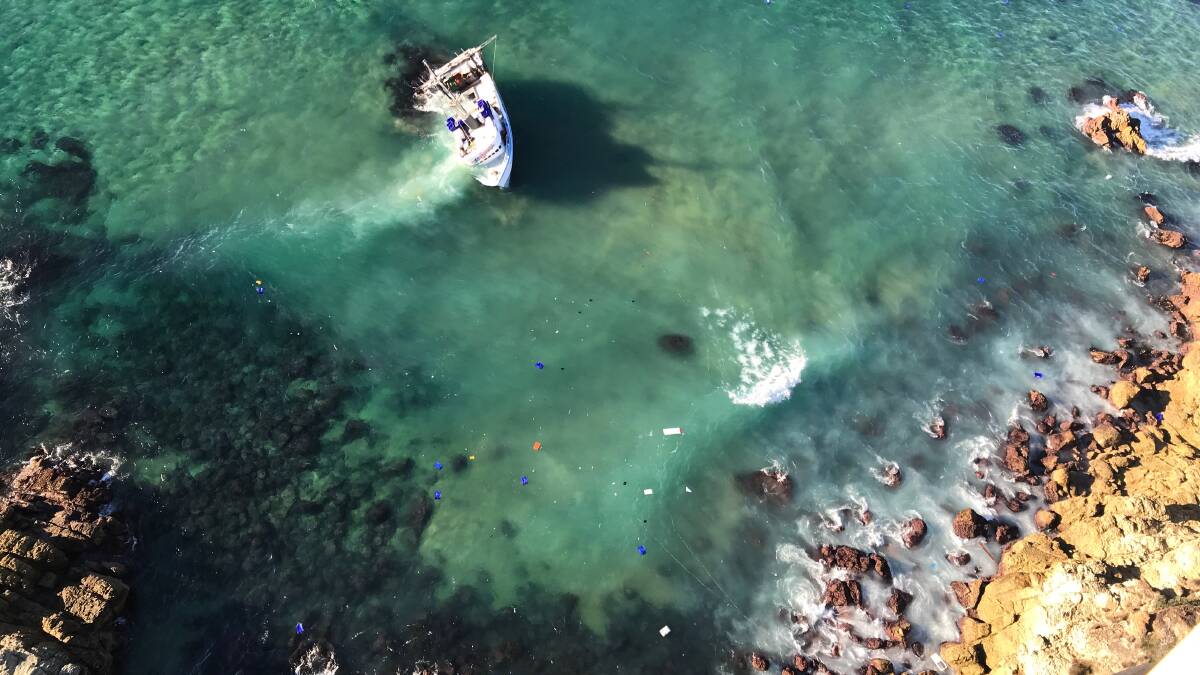 The stricken fishing trawler off Bengunnu Point on the morning of Saturday, July 7. Photo: Westpac Life Saver Rescue Helicopter.