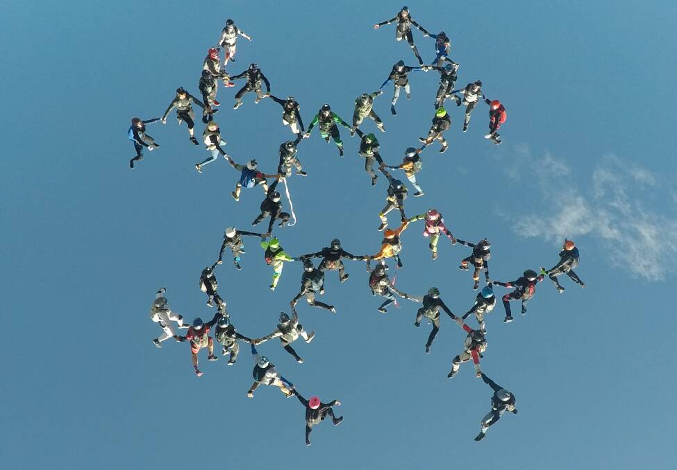 IN FORMATION: 44 skydivers descended on Moruya to help set a new Australian record. Photo: Mark Gazley.