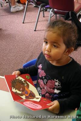 LITTLE ONE: Little Yuin student Shaniquah loves her book.