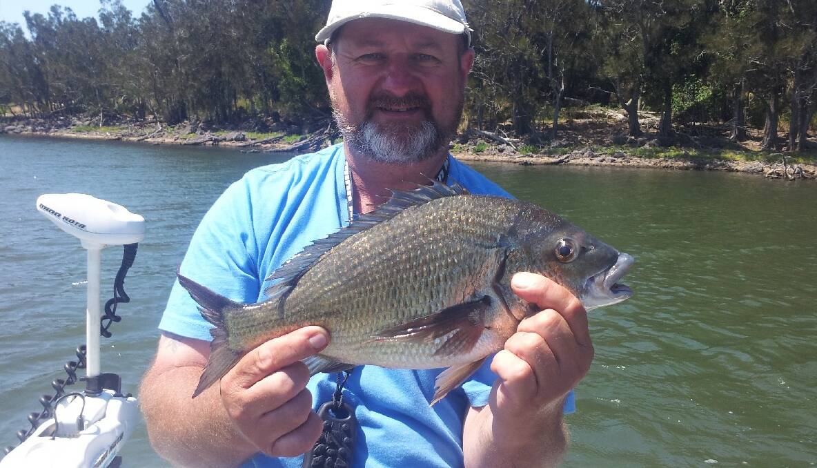UPSET ANGLER: Ron Bakos from Bungendore is a regular visitor and keen angler, as is evident by this 48cm black bream he caught on Coila Lake earlier this year. 