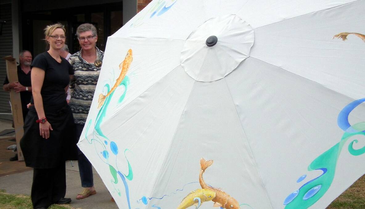 UMBRELLA 3: Sponsor Becky Moresi and artist Pauline Balos with their umbrella featuring a marine theme. 