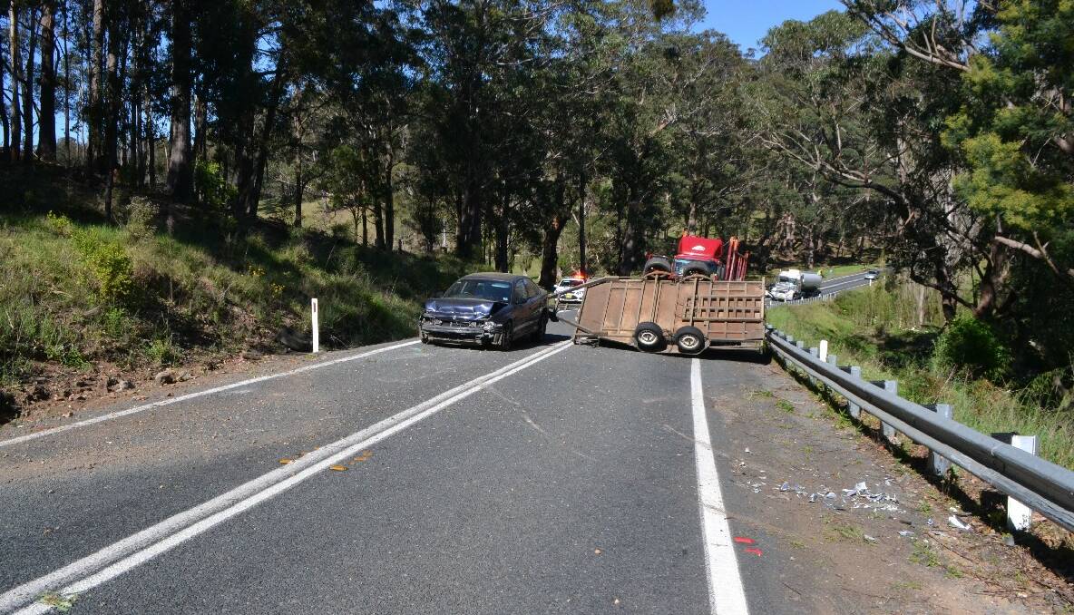 ACCIDENT SCENE: A single-vehicle accident near Tilba Tilba closed the Princes Highway on Friday morning. Swipe or click through for another photo. 