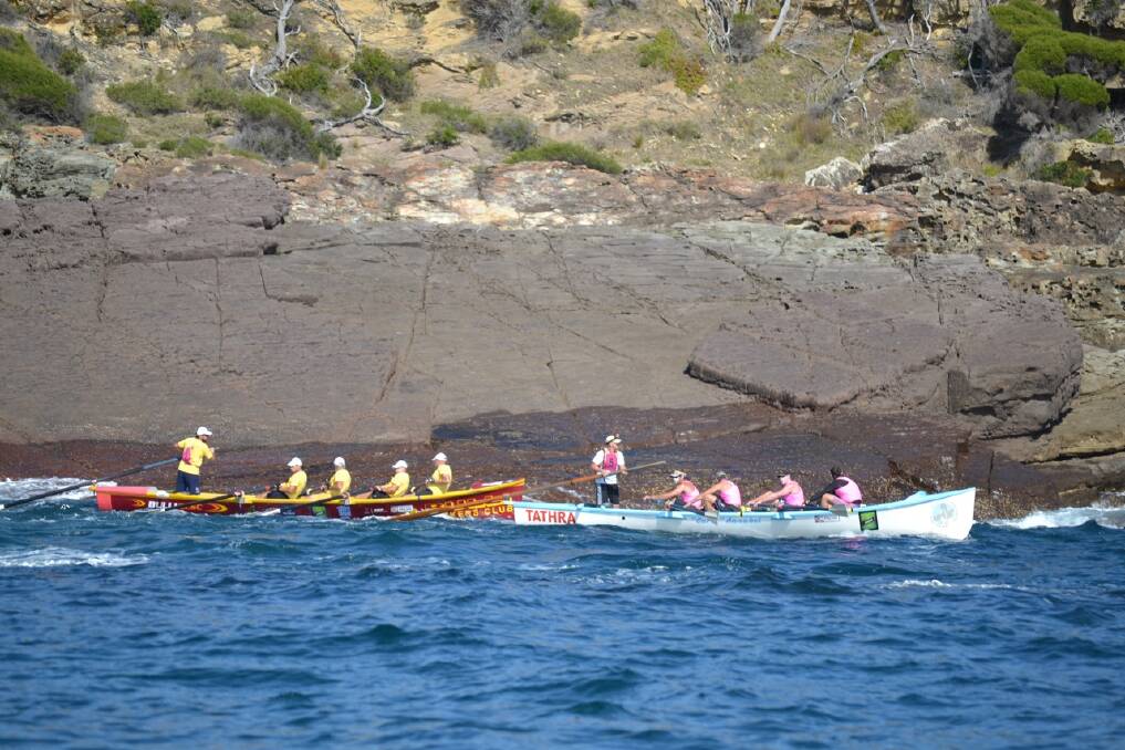 Giving chase to Narooma out of Eden are Tathra and Bulli. Narooma rounds the point out of Twofold Bay, Eden in perfect rowing conditions. Photo: Stan Gorton, Narooma News