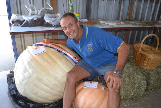 BIG PUMPKIN: Graham Parr and his 163kg pumpkin that won Champion Agricultural Exhibit at the Cobargo Show.
