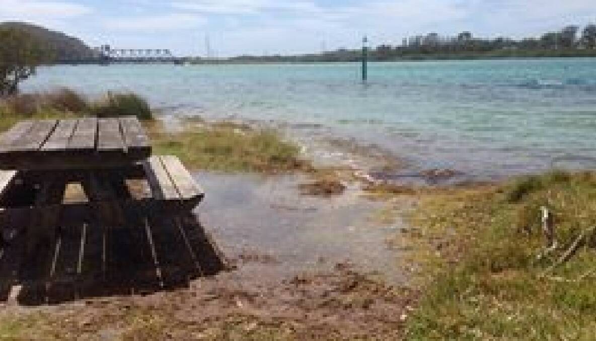 LEWIS ISLAND: Water encroaches on the picnic table at Lewis Island. 