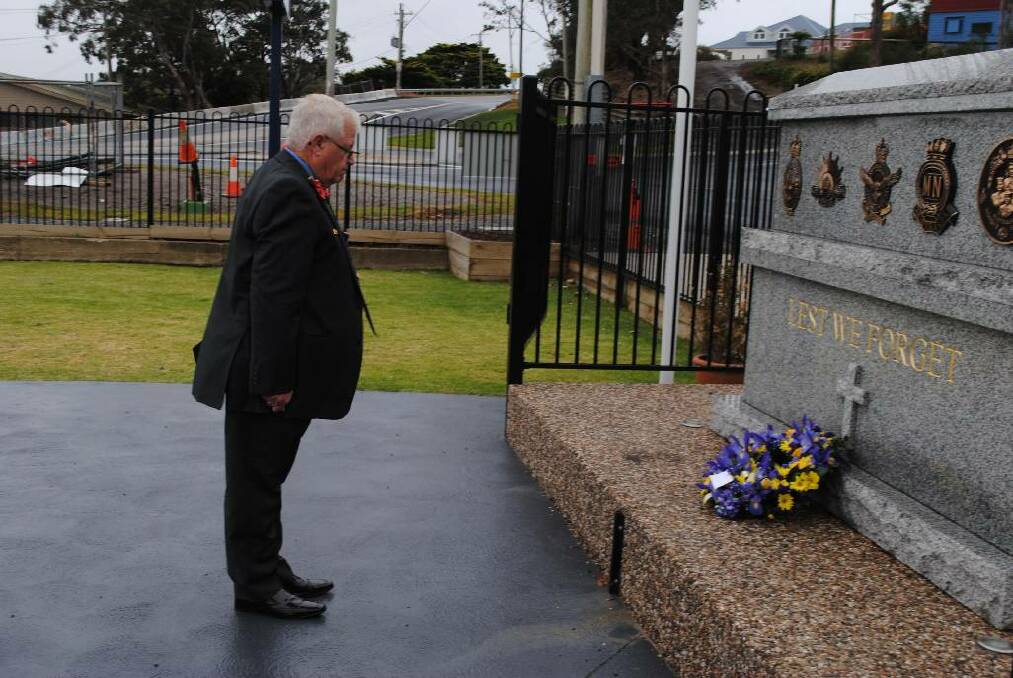 LEST WE FORGET: Narooma RSL sub-branch president Paul Naylor lays a wreath at the Remembrance Day service at Club Narooma on Monday. 
