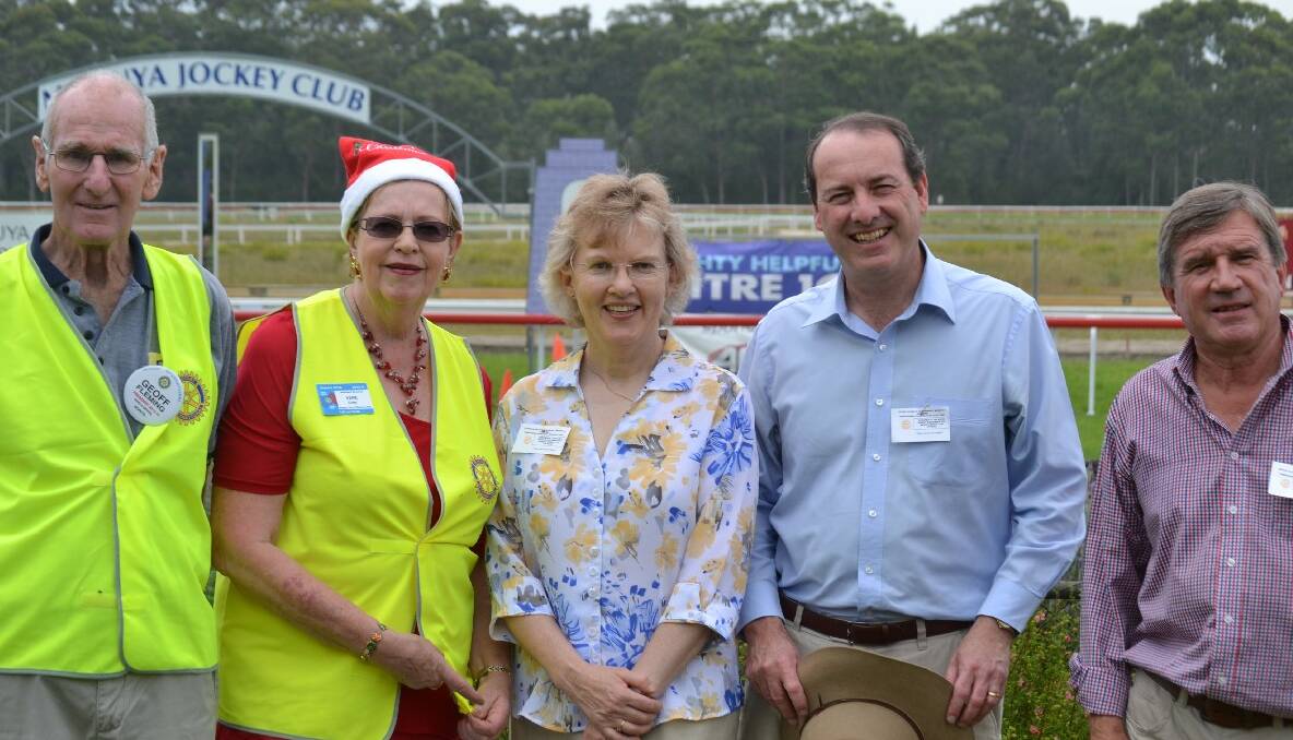 CANCER CARERS: Moruya Rotary president Geoff Flemming, Batemans Bay Rotary president Vere Gray and main organiser of the Christmas races, Bronwyn and Federal Member Peter Hendy and Cancer Carers president Rob Pollock at the races. 