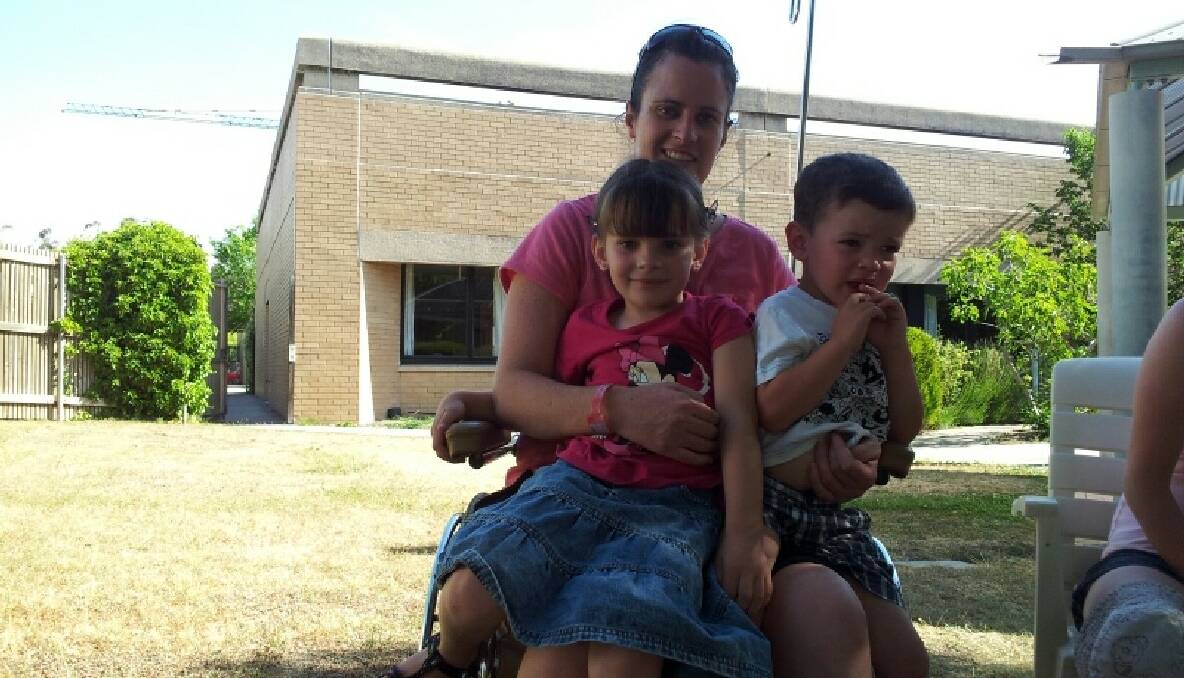 RECOVERING RIDER: Nicole Ogilvie of Bodalla is still recovering at Canberra Hospital with her two children Talicia and Jaelan. 