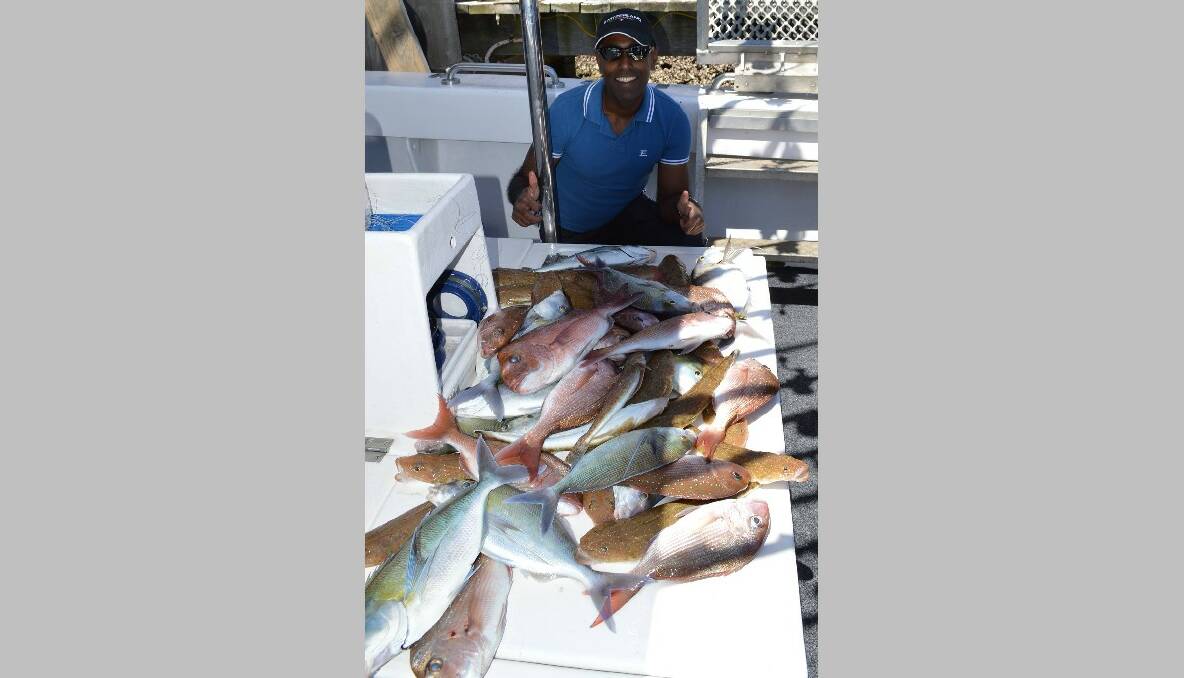 Lalit Prasad proudly displays the Australia Day Catch! A great mornings fishing with Wazza & Simon of Lighthouse Charters Narooma. Looks like fish for dinner!