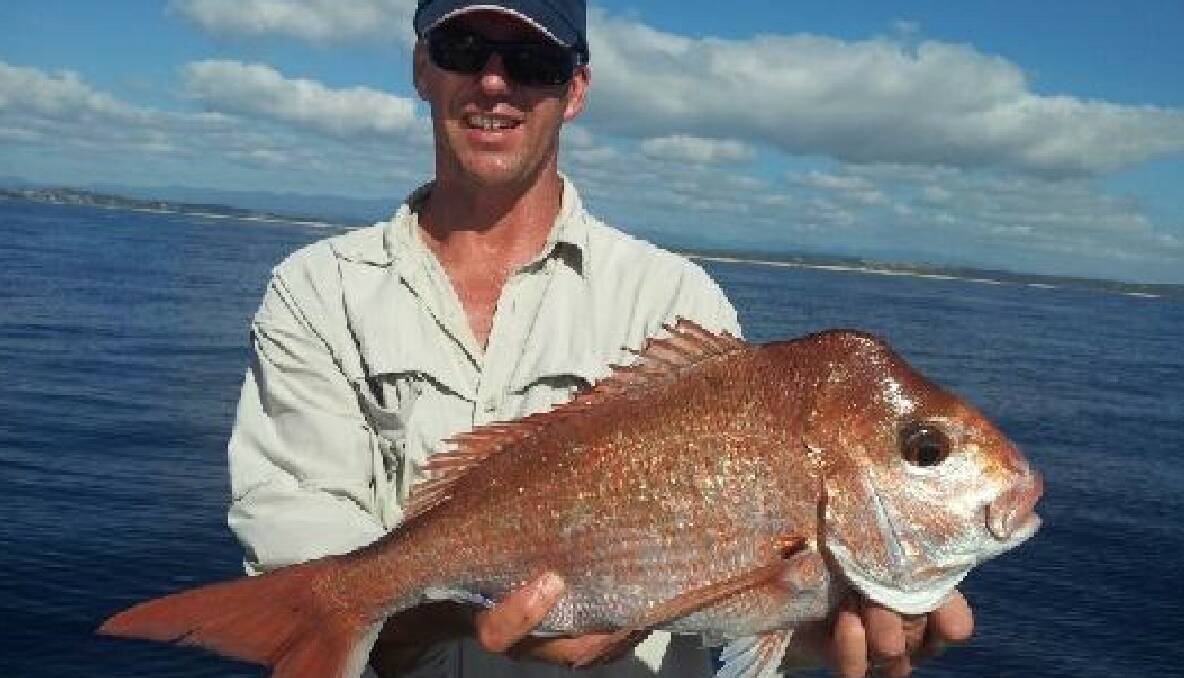 SNAPPER TIME: Wayne Cook from Wagga with the snapper caught up off Tuross on Monday on the Playstation. 