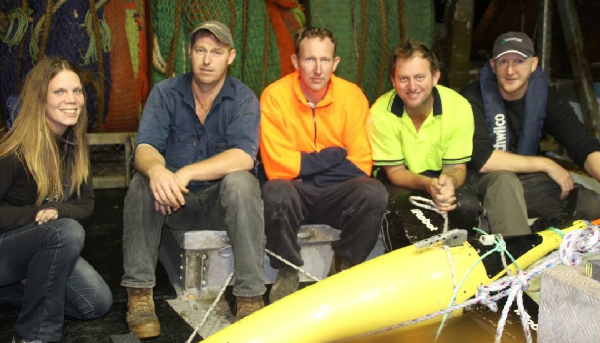 RESCUE MISSION: Researcher Amandine Schaeffer from UNSW, deckie Gary Bray, skipper Andrew Wintle, deckie Michael Franks and Stuart Milburn from NSW-IMOS, UNSW on board the trawler Shoalhaven with the recovered glider. 