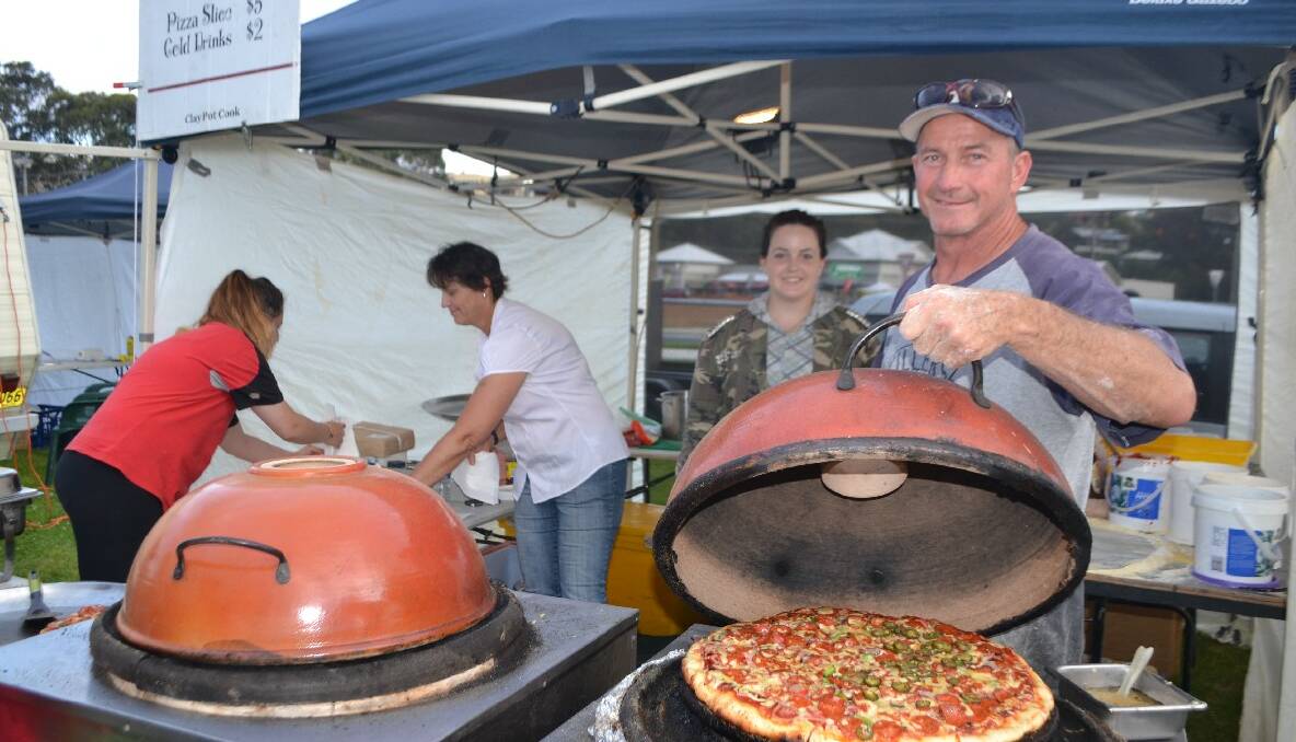 PIZZA MAN: Cameron Williams and his crew from Bodalla were kept busy creating pizzas at the carols. 