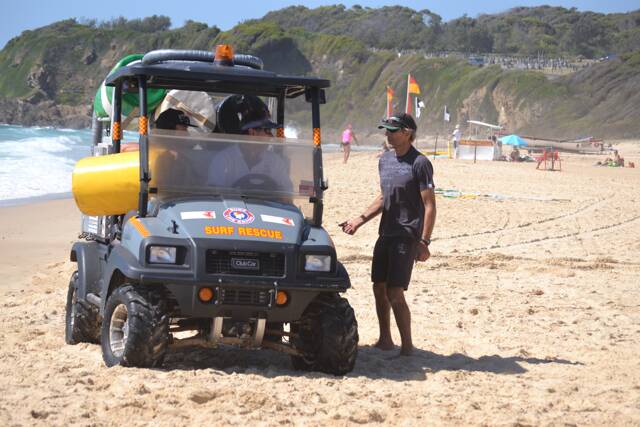 SURF ACTION: Geoff Newton from Narooma Outdoor Supplies checks on the side-by-side ATV he supplied to Narooma SLSC. Photo by Stan Gorton – Narooma News 