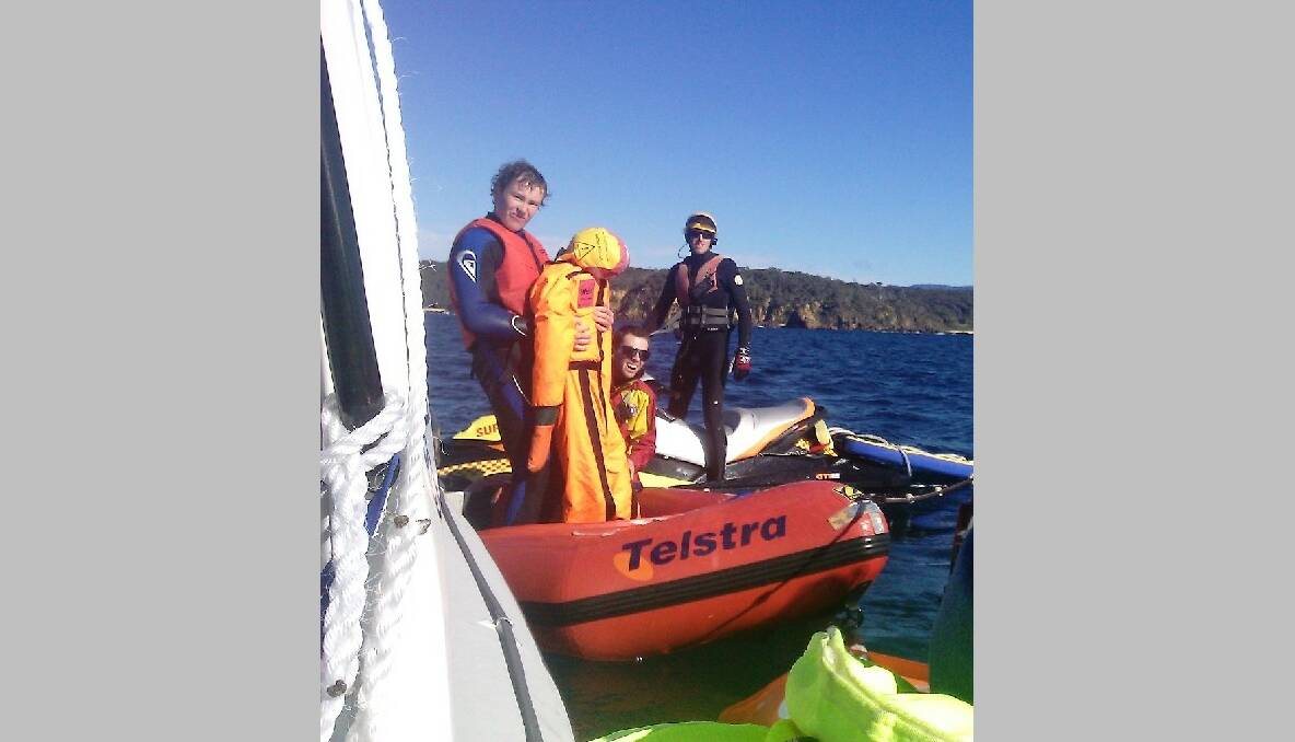 DUMMY RECOVERED: Surf life saving volunteers Josh Hay from Batemans Bay and Brad Kingston from Bermagui and Chris Smithers from Batemans Bay recover on the bodies from the Three Brothers area. Photo by Julia Mayo-Ramsey 
