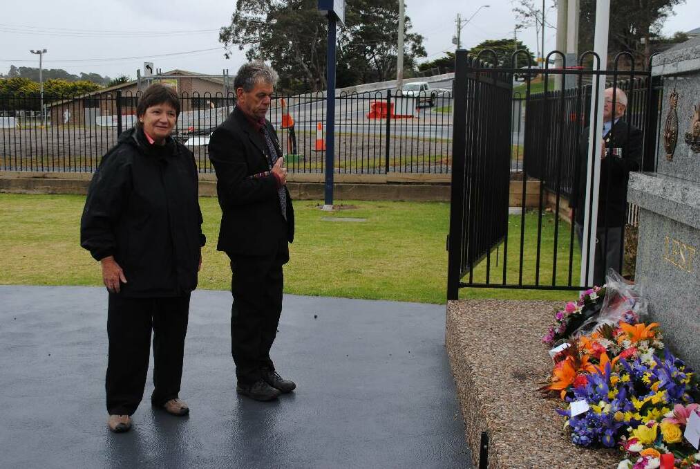 IN MEMORY: Laurelle Pacey and Trevor Bennett lay a wreath at the memorial at Club Narooma on Monday. 