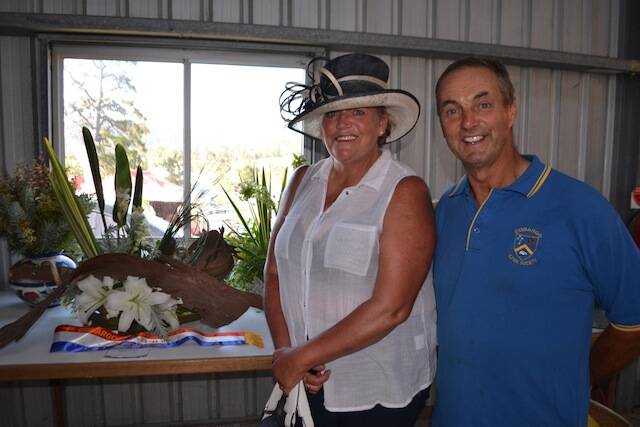 CHAMPION ARRANGEMENT: Kim Taylor from Central Tilba with her Champion Floral Arrangement and show committee member Graham Parr.