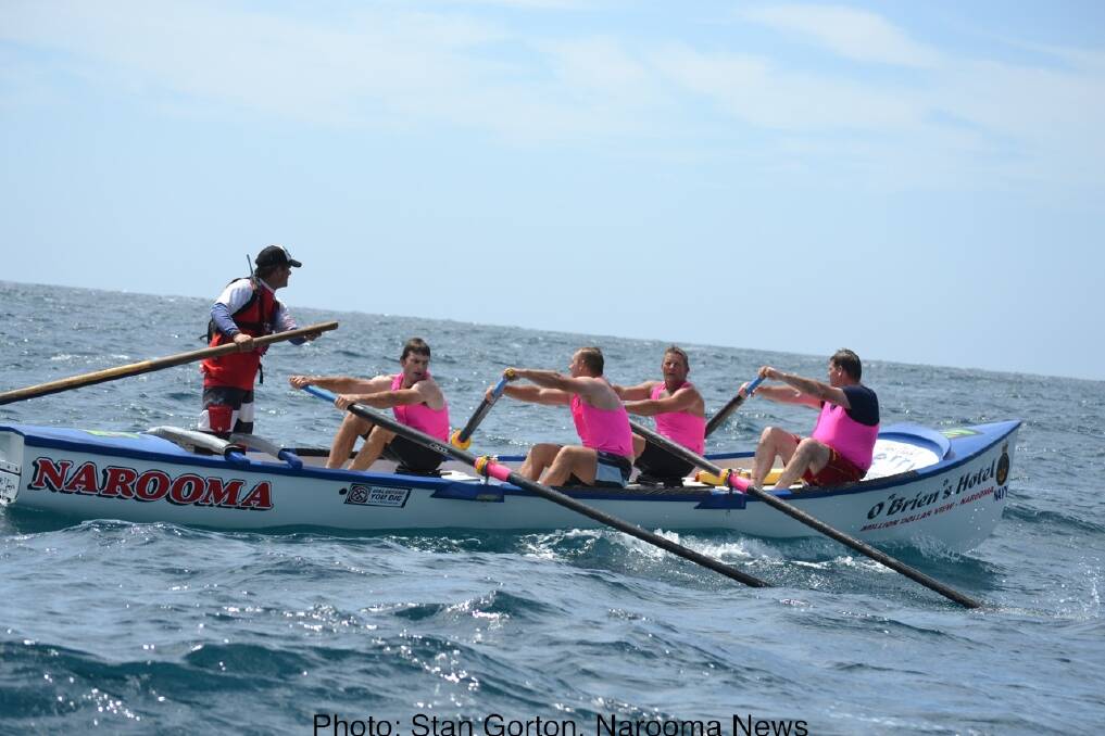 LONG AND HARD: Rowing long and hard off Bermagui are Narooma rowers Rod Patmore, Adam Morris, Unto Holopainen and Stuey Croser. Photo: Stan Gorton, Narooma News