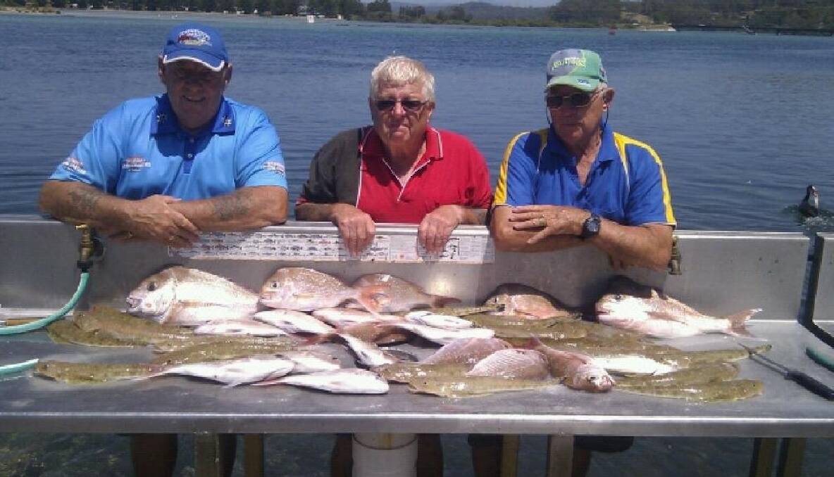 BOWLO CREW: NSSC Bowlo Fishing Club members Col Armstrong, Paul Naylor and John King with snapper, up to almost 2kg, and flathead taken on board Narooma Fishing Charters. 
