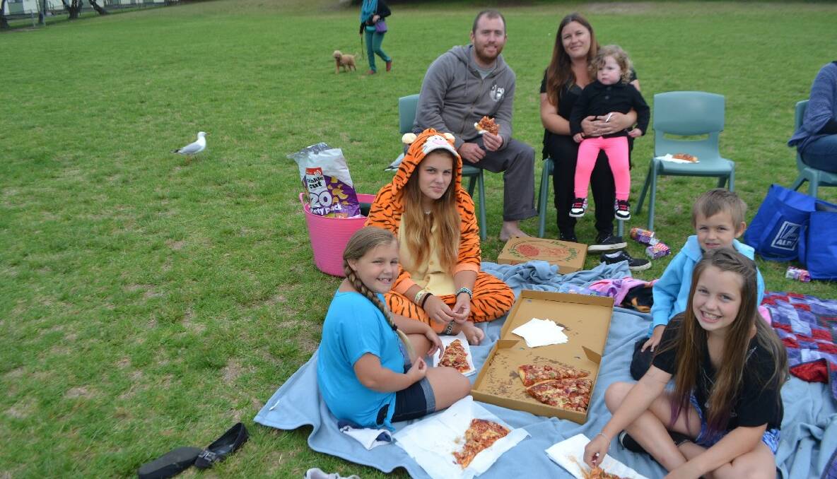 PIZZA TIME: Enjoying their pizza are Dave Moran and Jaime Bolton with kids Leah, Jayden, Kurtis, Reese and Tayla. 