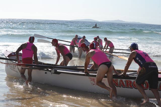 SURF ACTION: Narooma SLSC rowers prepare the surfboat. Photo by Stan Gorton – Narooma News 