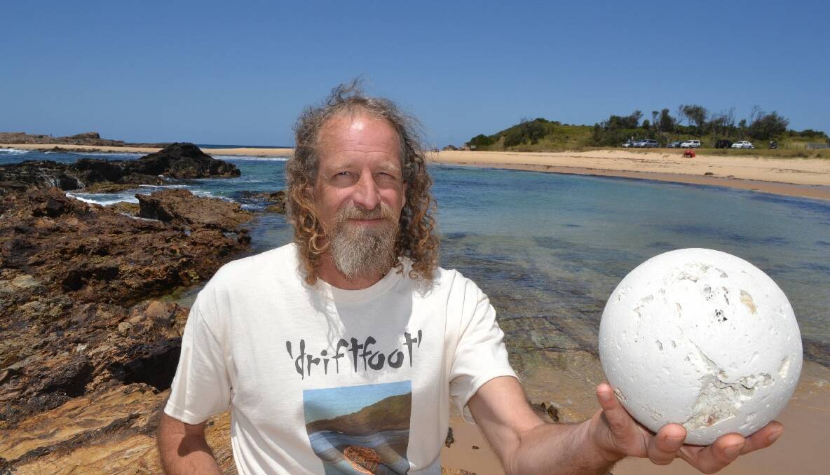 PUMICE BALL: Ephemeral artist Dean Ware with his latest creation – a ball made of pumice he found on the beach at his new home at Mystery Bay.  