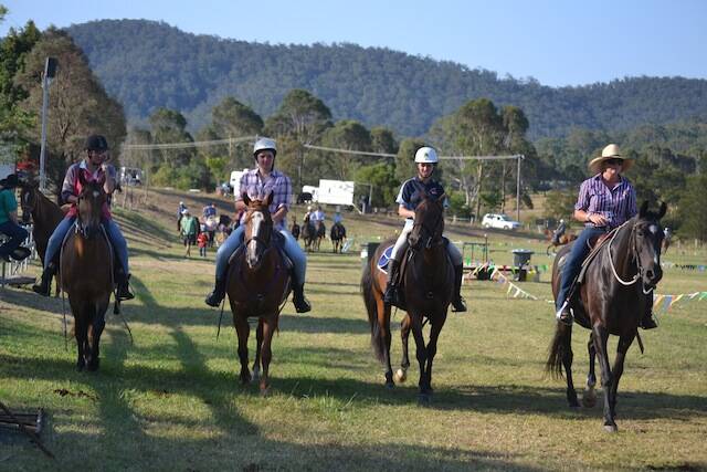 HORSE GIRLS: Emma Hodges of Bega (far right) leads a group of horse girls to the campdrafting competition.